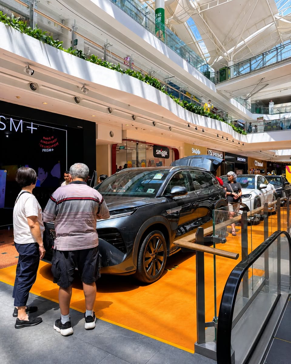 BYD SUV on orange platform at Jurong Point