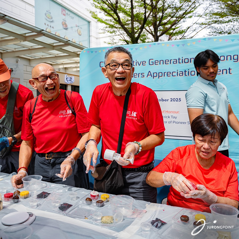 Participants happily engaging in a mooncake making activity.