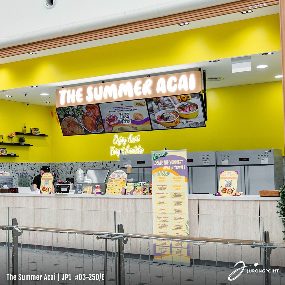 Someone enjoying The Summer Açaí bowl, symbolizing a tropical escape