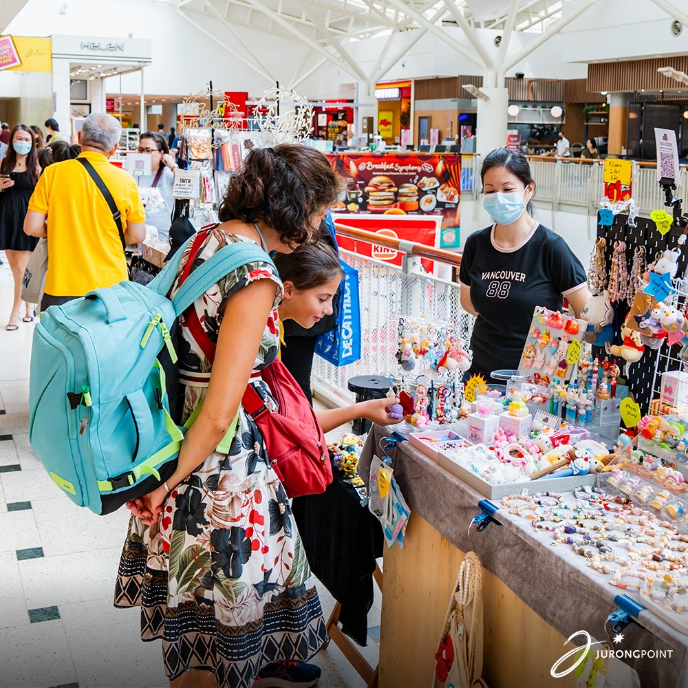 People browsing and discovering unique goods at the Crafters Market