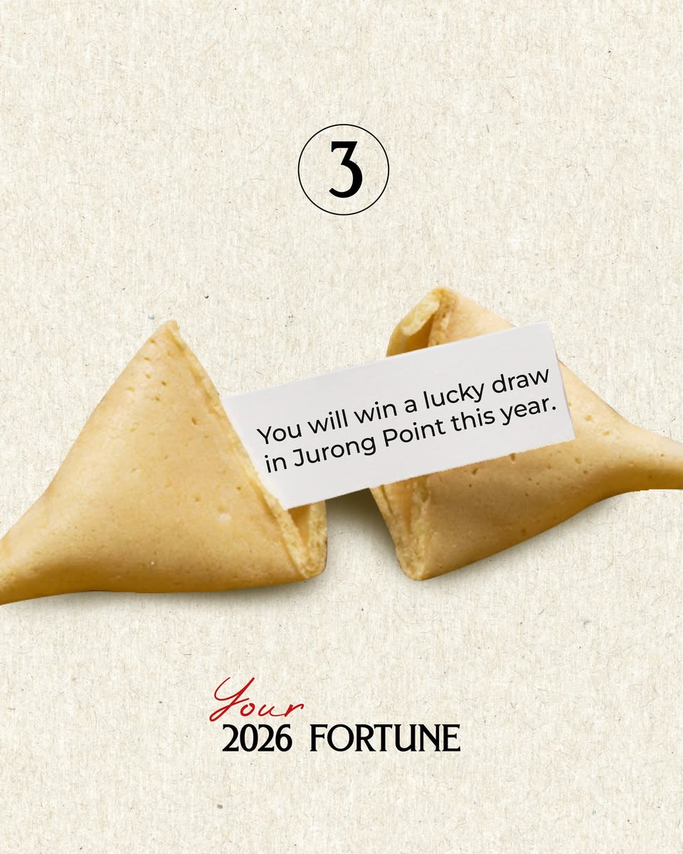 Close-up of a cracked fortune cookie with a message