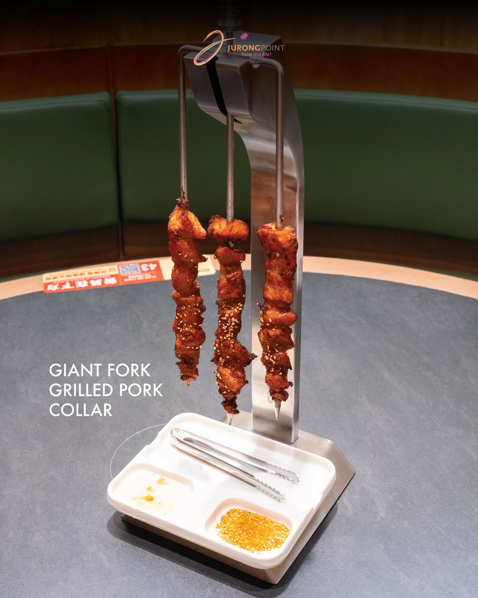 Little Pond Giant Fork Grilled Pork Collar skewers on vertical spit rack at Jurong Point