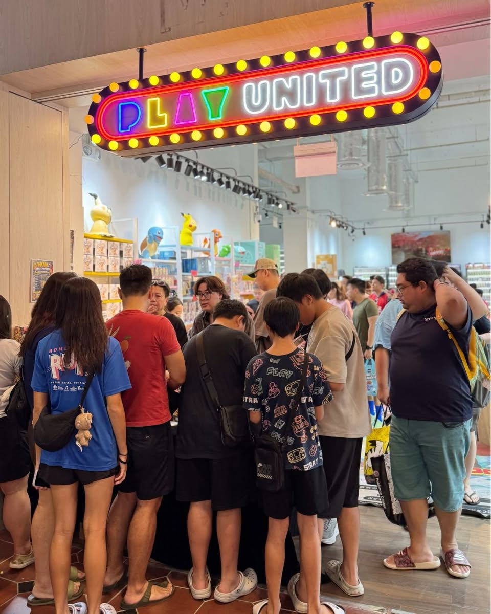 Play United neon sign and storefront entrance at Jurong Point JP2 #03-68 with customers queuing