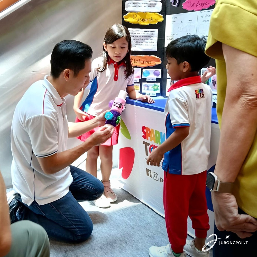 Children engaging in a STEMIE invention activity at the fair