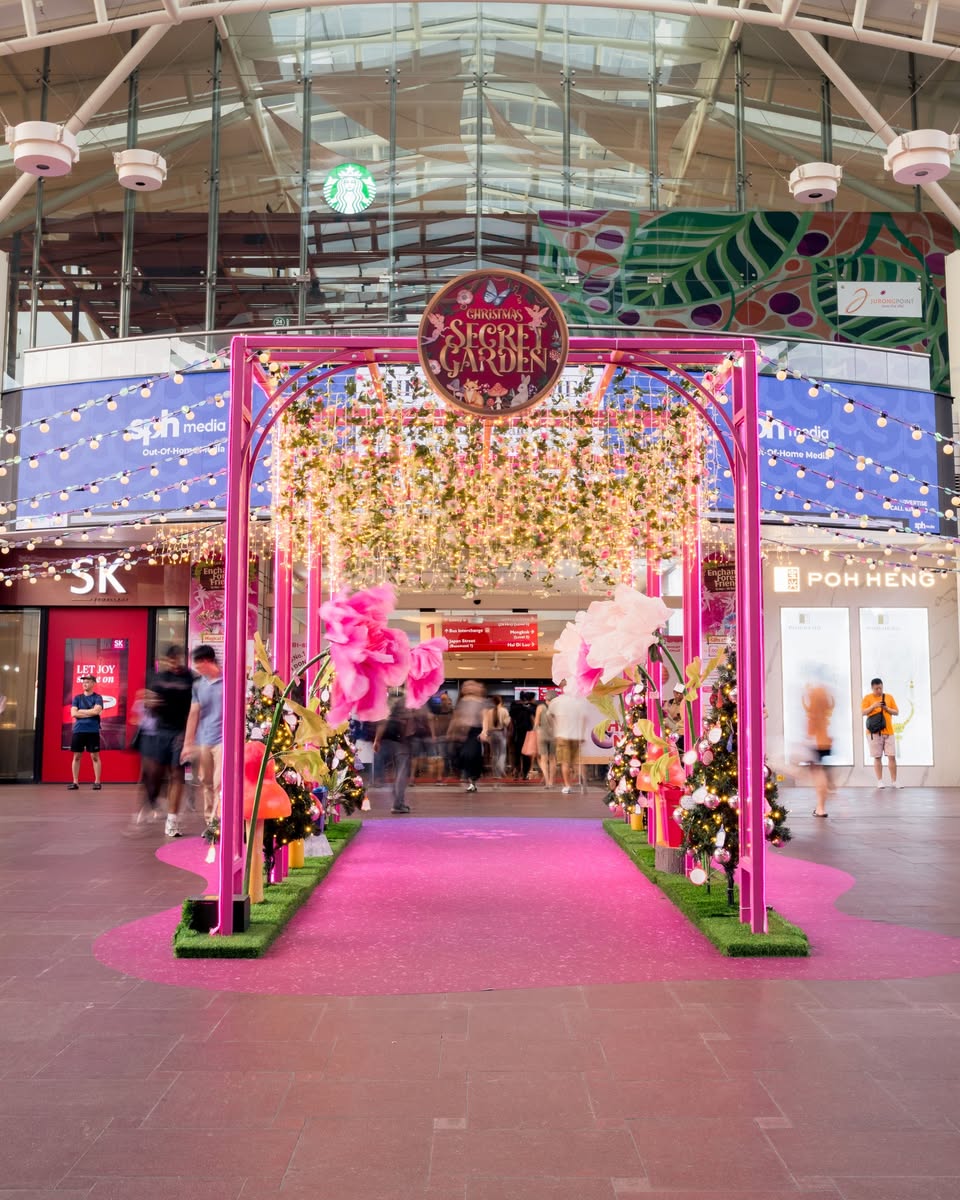 A bustling Christmas fair setup with holiday merchandise at Jurong Point