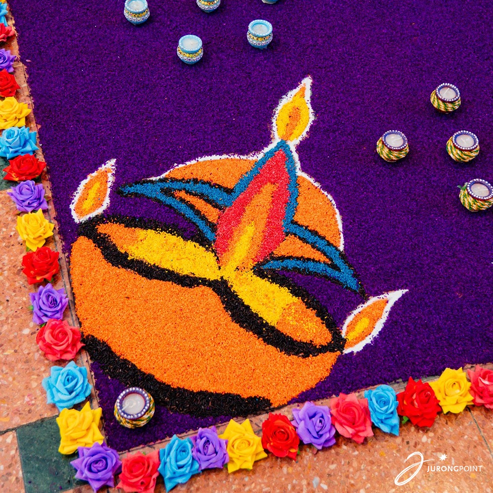 A wider view of the rangoli, showcasing its scale and beauty.