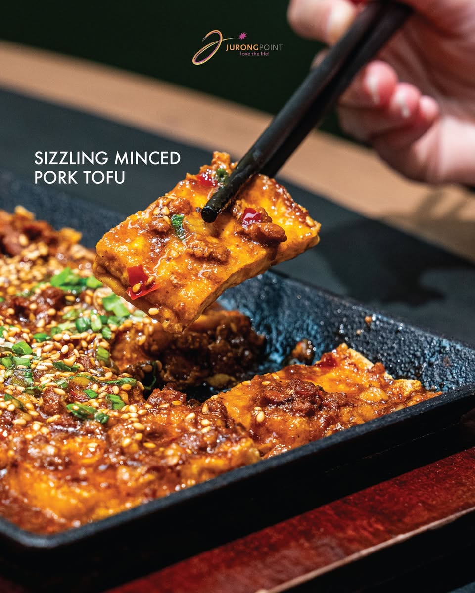 Little Pond Sizzling Minced Pork Tofu served on griddle pan with sesame seeds and green onions at Jurong Point