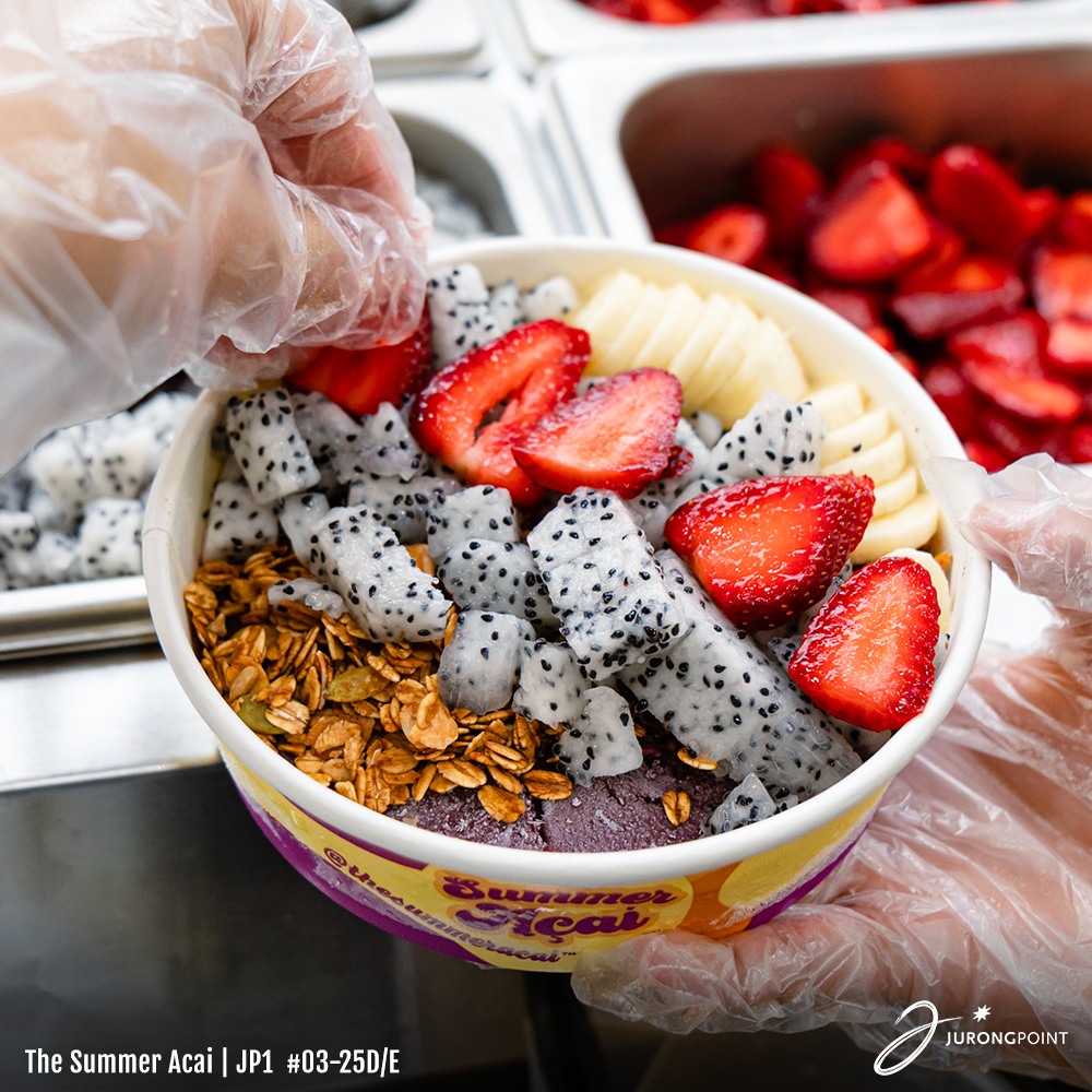 A vibrant açaí bowl with fresh fruits and toppings, ready to cool you down